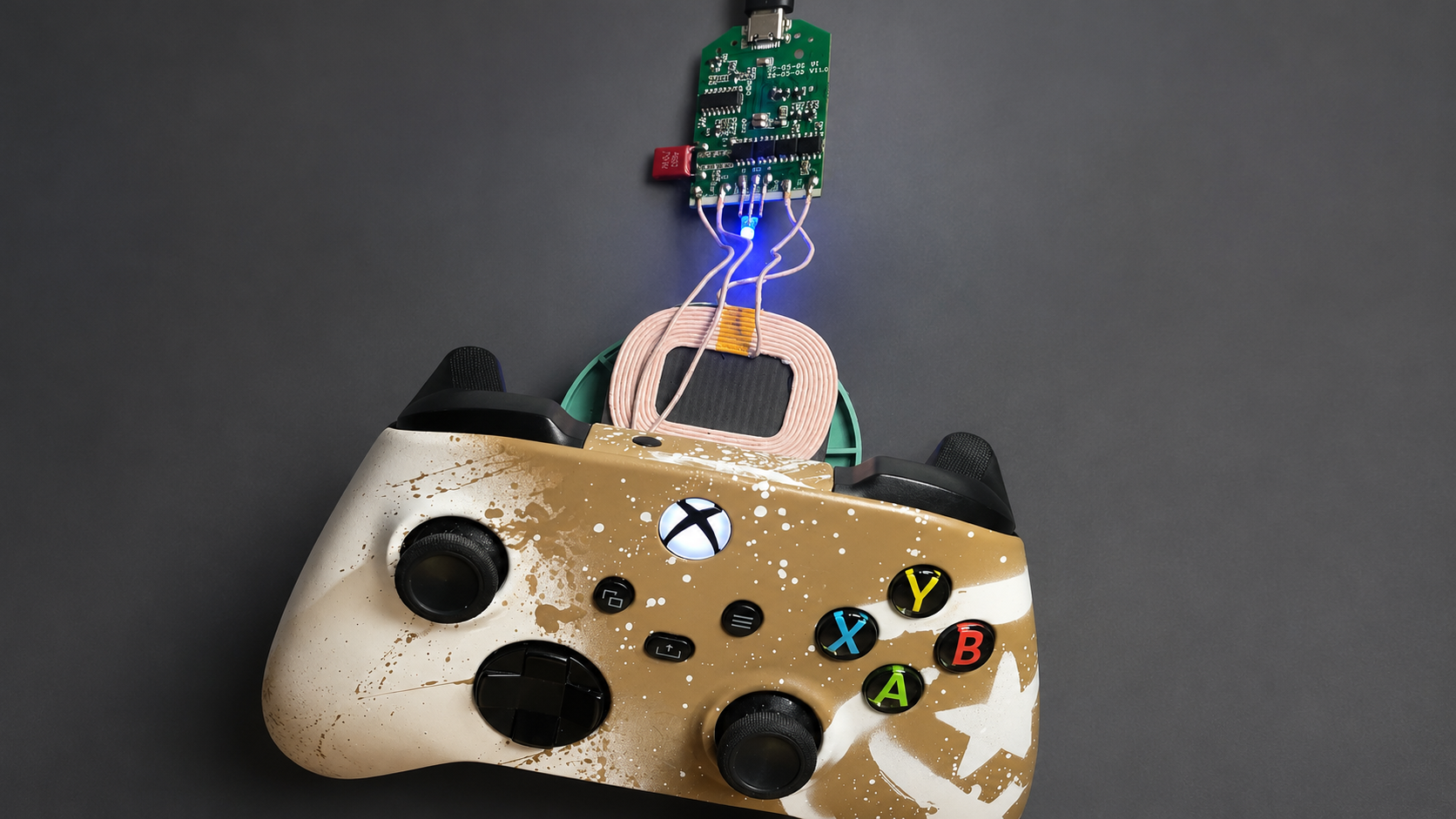 Wireless-charging Xbox controller with rechargeable battery, receiver coil, and charging electronics